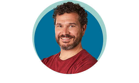 Adult man smiling with blue background